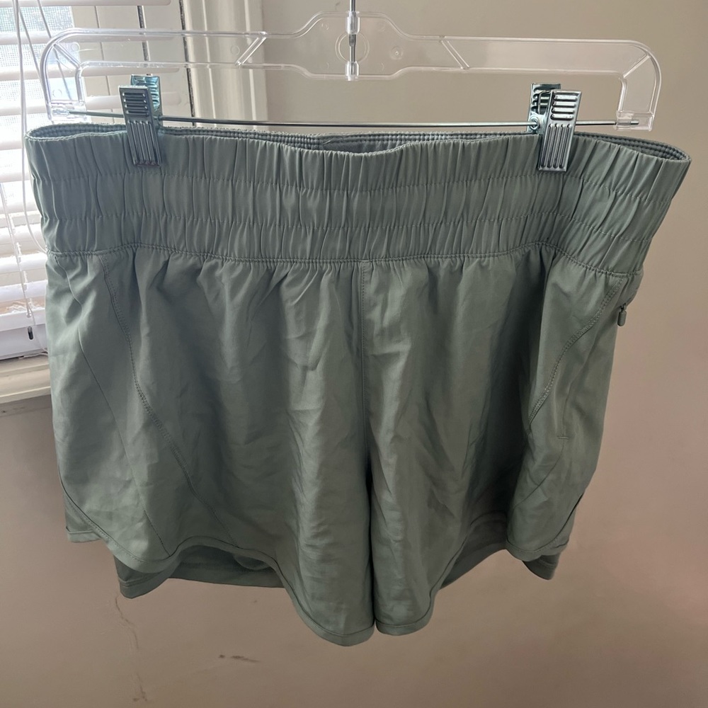 Size medium sage green Avia running shorts w/ spandex attached